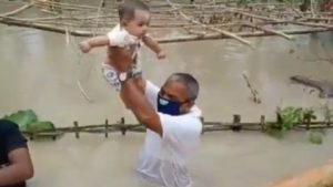 Assam MLA Mrinal Saikria rescues baby in waist deep floodwaters risking his own life
